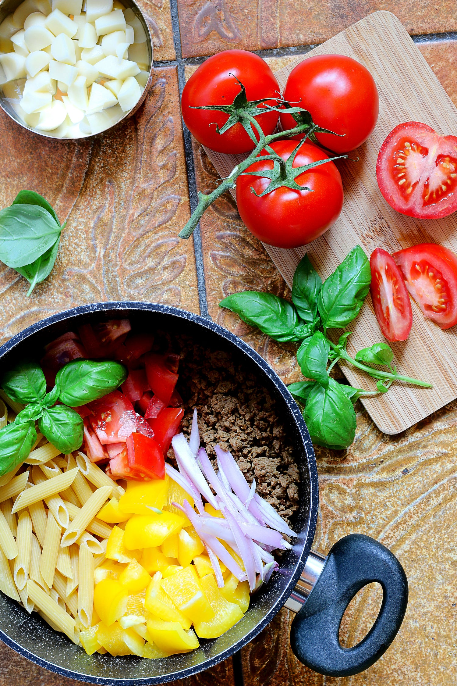pasta, meat and vegetables in pot